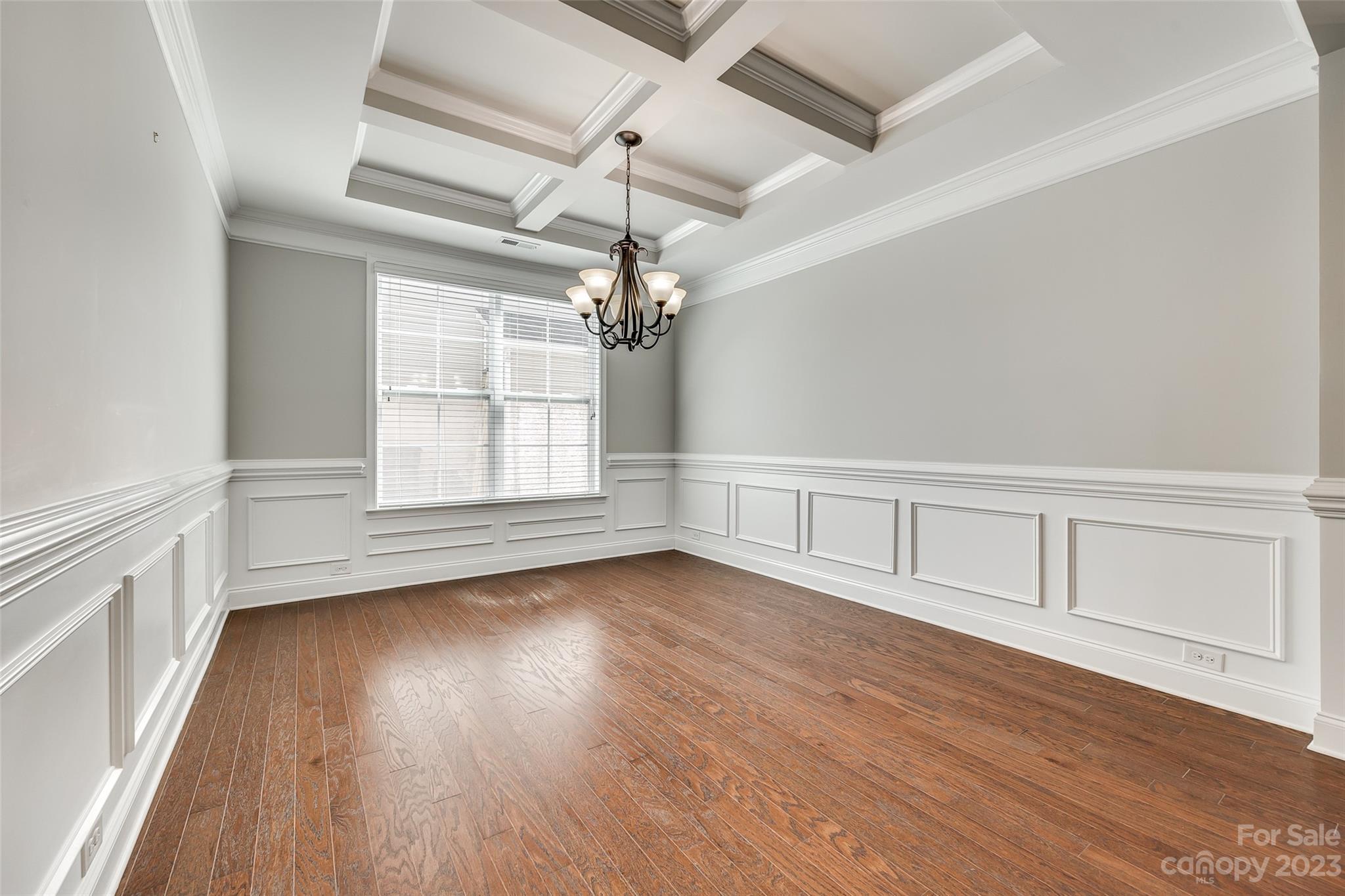 198 Annatto Way Tega Cay, SC 29708 - Photo 9 of 45 wooden floor in an empty room with a window