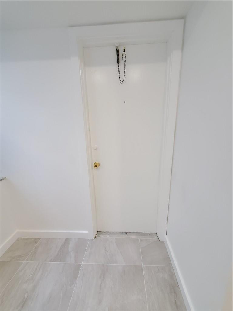 6903 Cypress Road, Unit B25 Plantation, FL 33317 - Photo 24 of 38 KITCHEN DOOR TO CATWALK