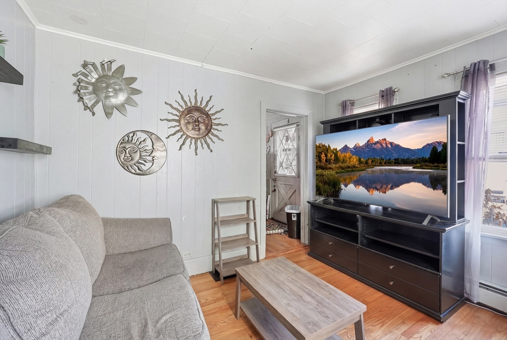 22 Vigeant Street Ware, MA 01082 - Photo 5 of 16 a living room with furniture and a flat screen tv
