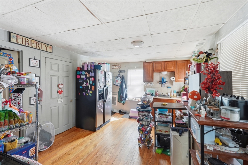 22 Vigeant Street Ware, MA 01082 - Photo 7 of 16 a room with furniture a chandelier and a window