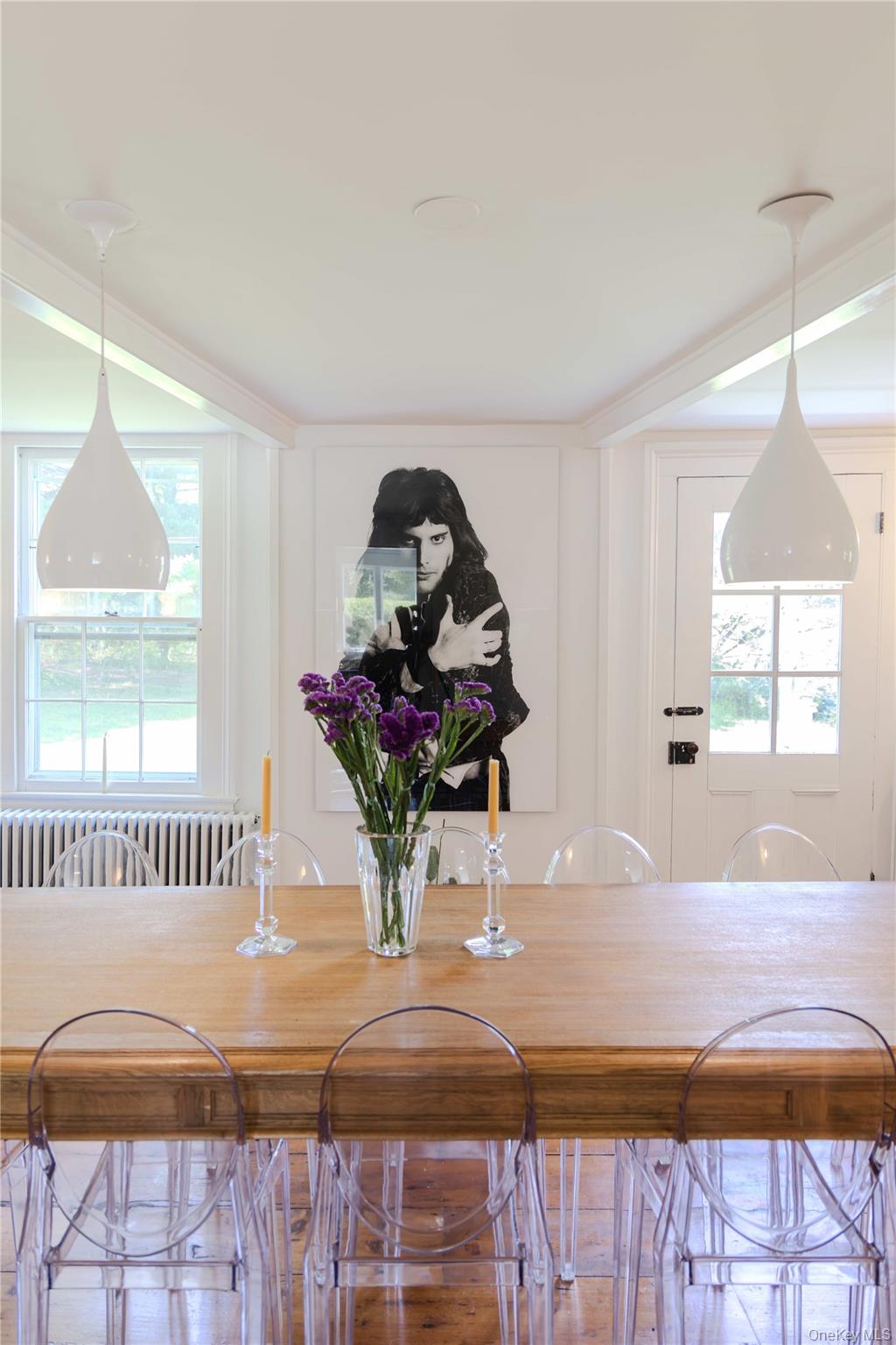 210 Middle Road Hudson, NY 12534 - Photo 22 of 42 Dining area featuring a wood-finish table, dual contemporary pendant lights, and classic white trim throughout