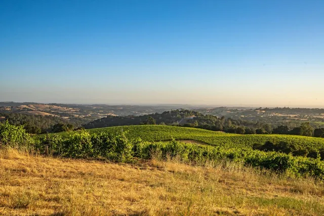 a view of an ocean and a mountain