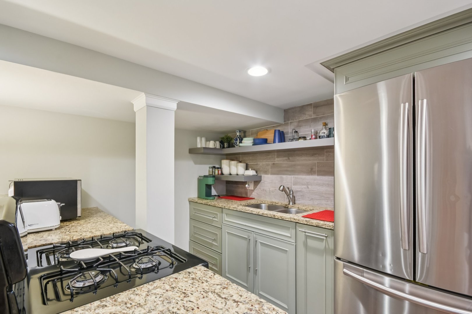 2928 North Rutherford Avenue Chicago, IL 60634 - Photo 19 of 25 a kitchen with stainless steel appliances granite countertop a refrigerator and a stove top oven