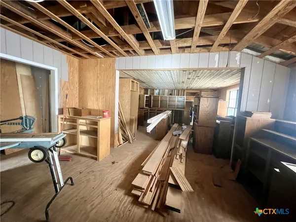 a bed room with a bed and a chair