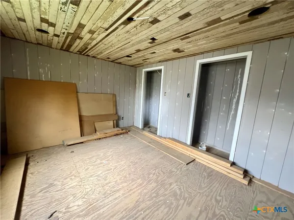 a view of a house with a yard and garage
