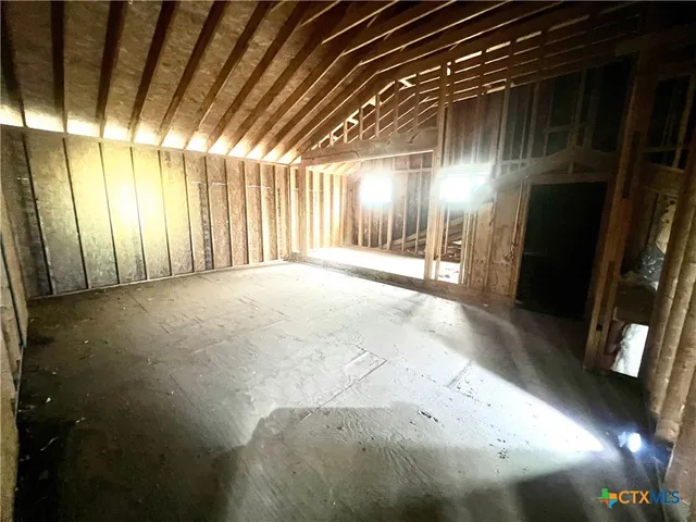 a view of a kitchen area with furniture and a window