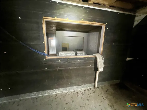 a bathroom with a shower and a sink