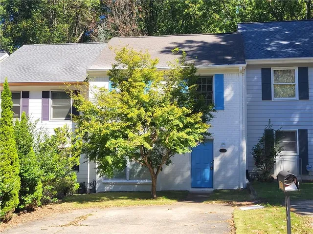 a house view with a garden space