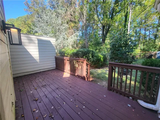 a view of deck with wooden floor and fence