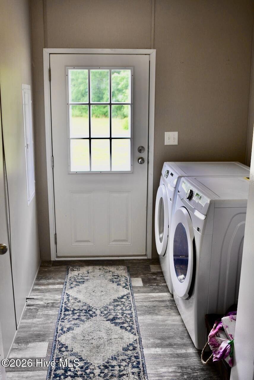 1430 Nixonton Road Elizabeth City, NC 27909 - Photo 22 of 30 The laundry/mud room. This is also the back entrance with a small porch. The washing machine, dryer and upright deep freezer do not convey unless the buyer opts to purchase the house fully furnished for an additional $10,000.