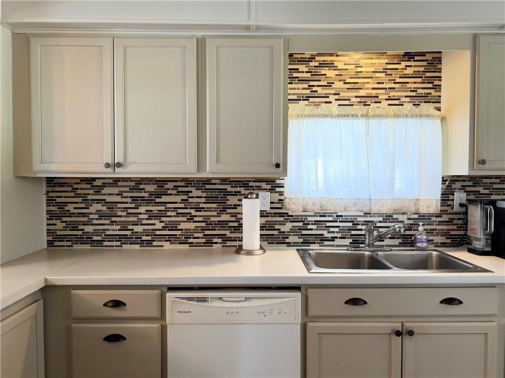 Equipped kitchen with natural light.