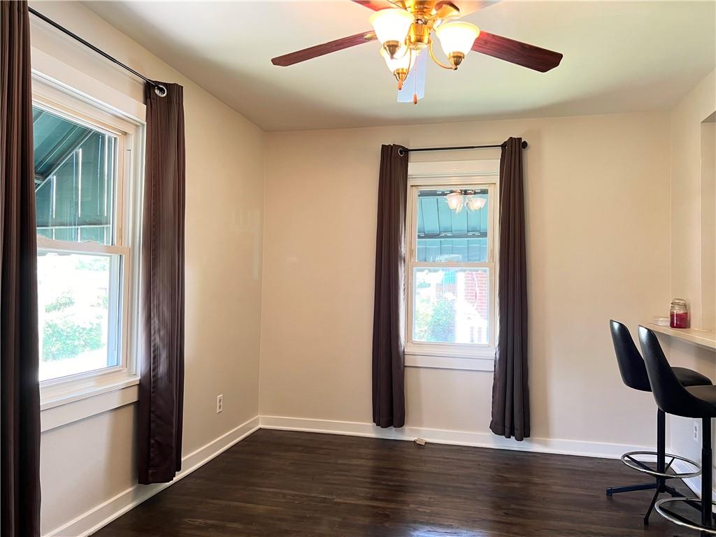 Dining room with hardwood flooring.