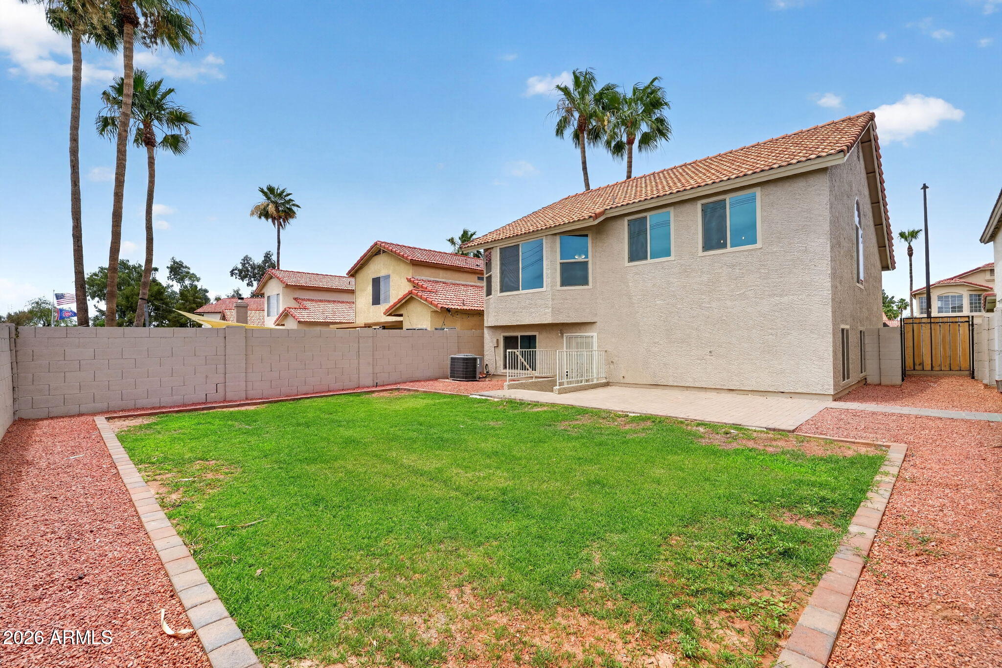 1417 East Mineral Road Gilbert, AZ 85234 - Photo 51 of 59 a front view of a house with a garden and yard