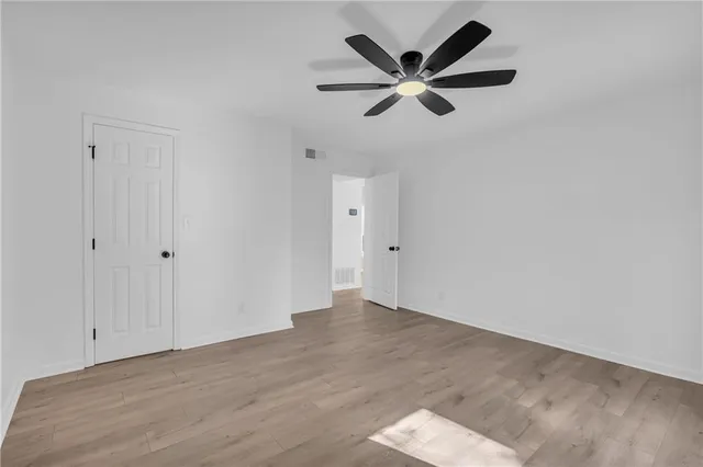 a view of a big room with wooden floor