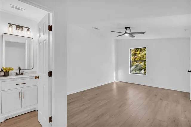 a view of an entryway with wooden floor