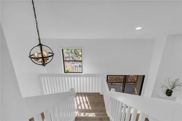 a view of a hallway with windows