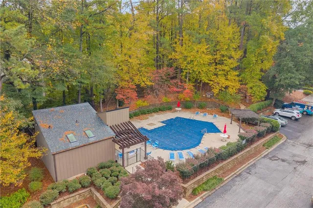 an aerial view of residential houses with outdoor space