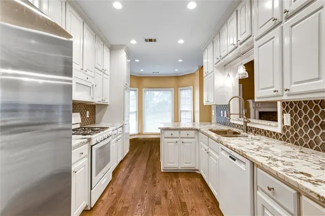 a large kitchen with a stove top oven