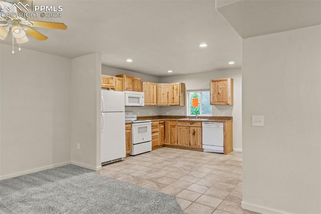 6010 Oak Street Rye, CO 81069 - Photo 15 of 29 a kitchen with stainless steel appliances a refrigerator and microwave
