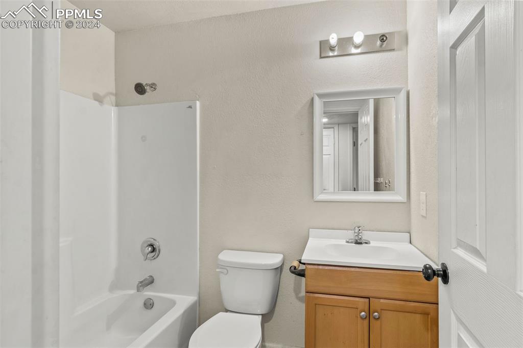 6010 Oak Street Rye, CO 81069 - Photo 7 of 29 a bathroom with a toilet sink vanity tub and mirror