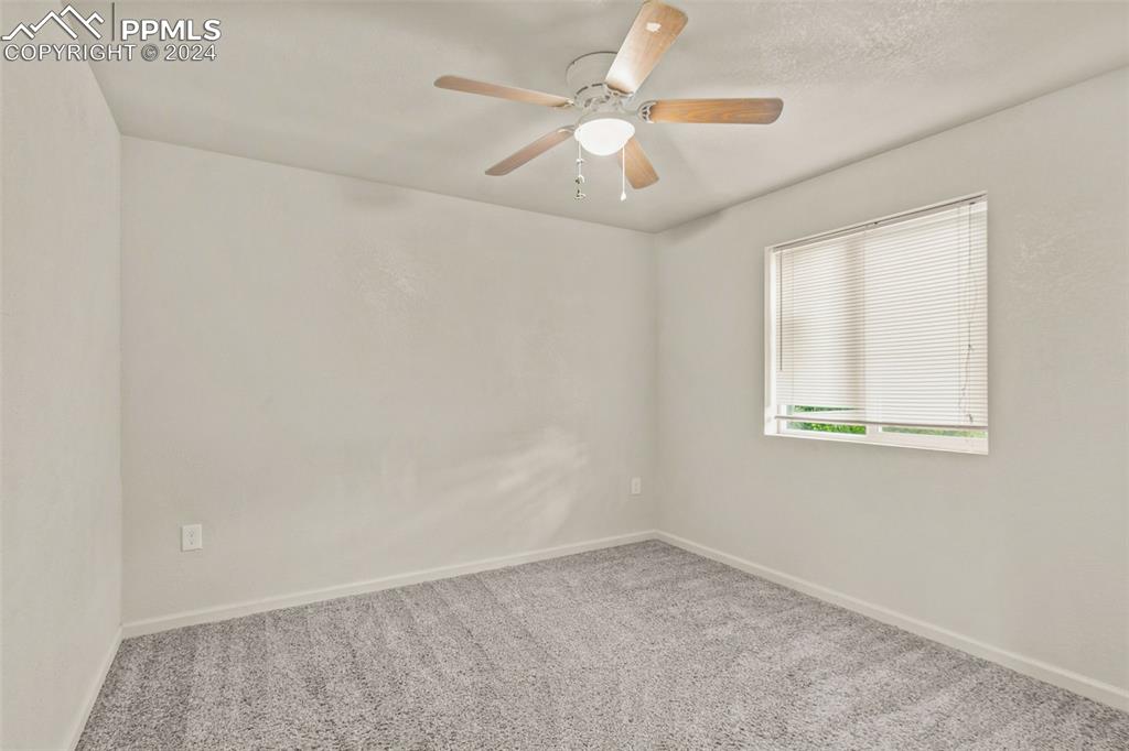 6010 Oak Street Rye, CO 81069 - Photo 8 of 29 an empty room with windows and fan
