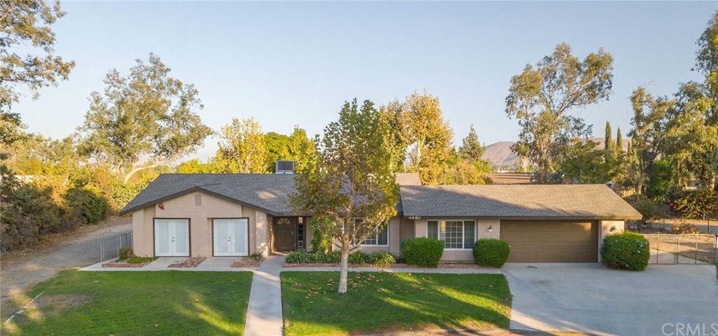 4680 Glen Street Riverside, CA 92509 - Photo 1 of 1 a front view of a house with garden