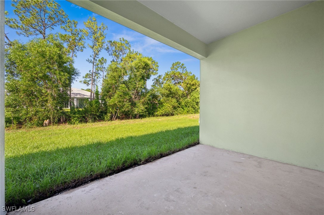 4701-4703 28th Street Southwest Lehigh Acres, FL 33973 - Photo 21 of 37 a view of a yard with a tree