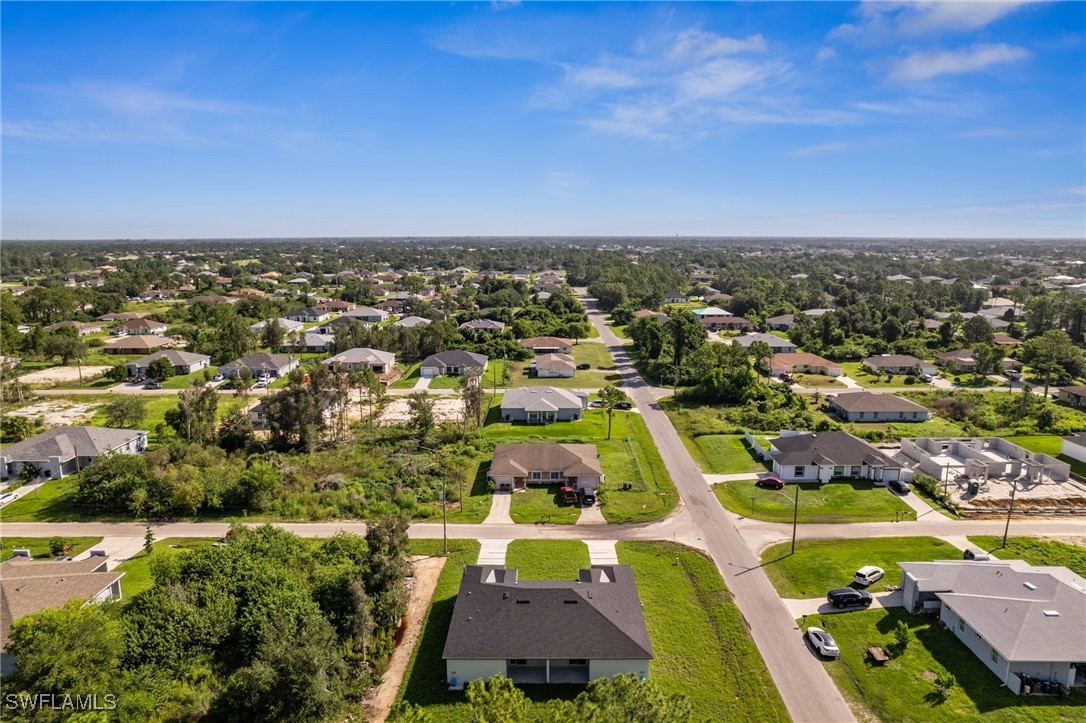 4701-4703 28th Street Southwest Lehigh Acres, FL 33973 - Photo 28 of 37 an aerial view of residential houses with outdoor space
