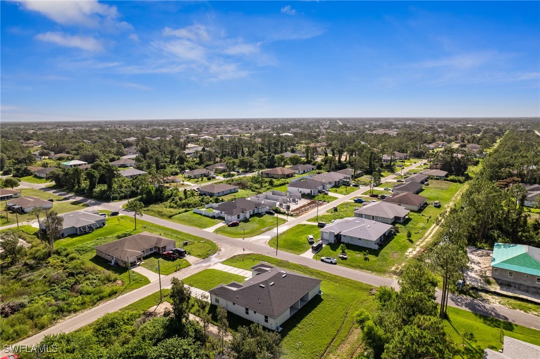 4701-4703 28th Street Southwest Lehigh Acres, FL 33973 - Photo 29 of 37 an aerial view of residential houses with outdoor space