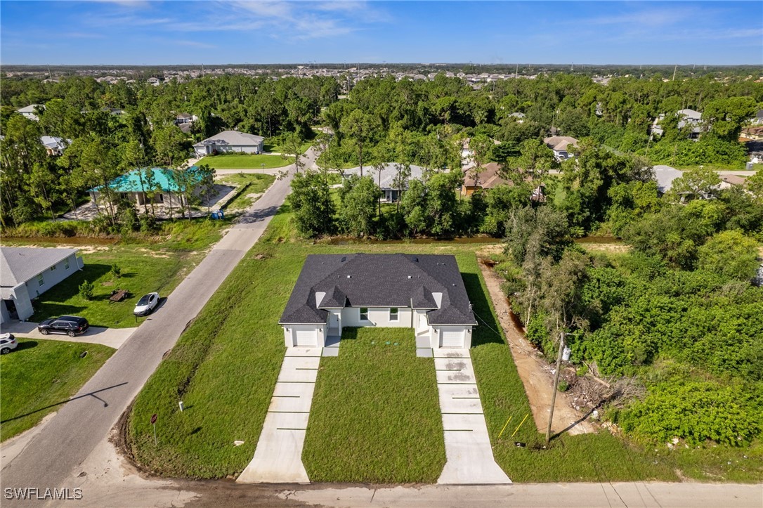 4701-4703 28th Street Southwest Lehigh Acres, FL 33973 - Photo 31 of 37 an aerial view of a house