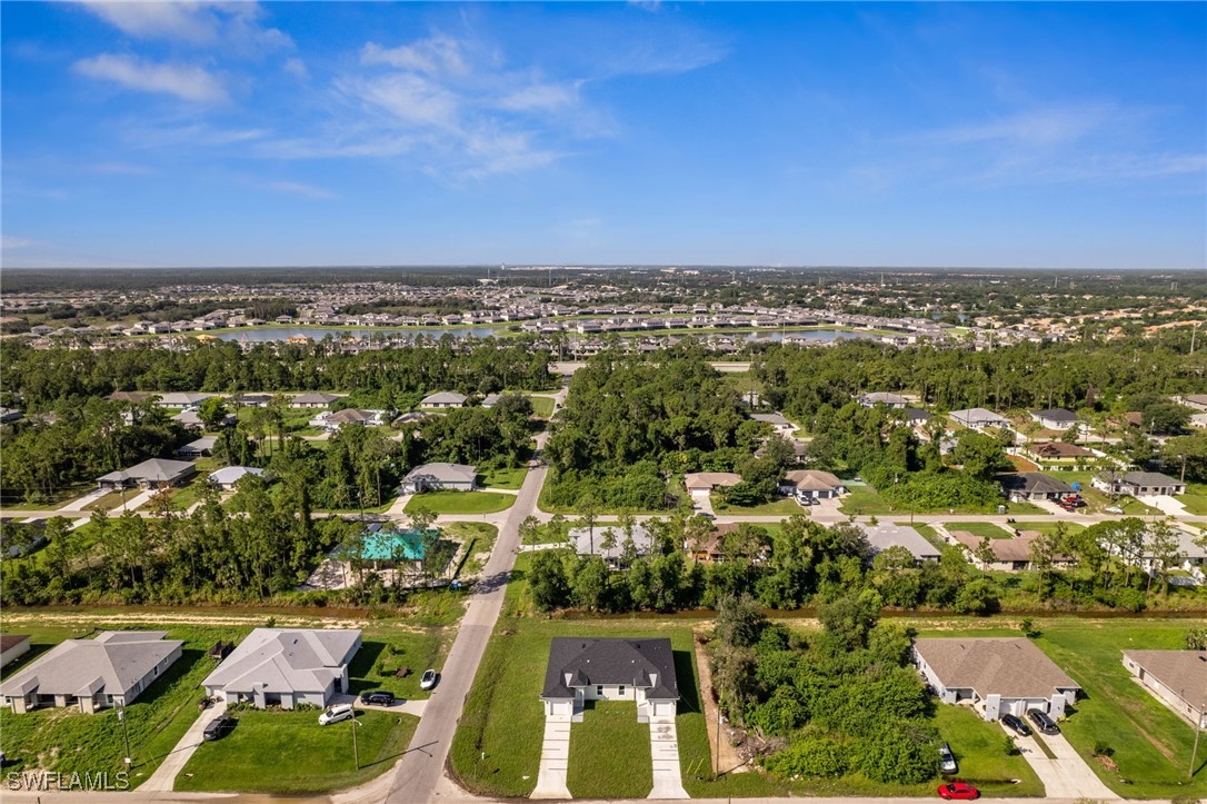 4701-4703 28th Street Southwest Lehigh Acres, FL 33973 - Photo 36 of 37 an aerial view of residential houses with outdoor space