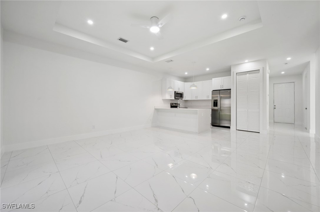 4701-4703 28th Street Southwest Lehigh Acres, FL 33973 - Photo 4 of 37 a view of kitchen with refrigerator sink and cabinets