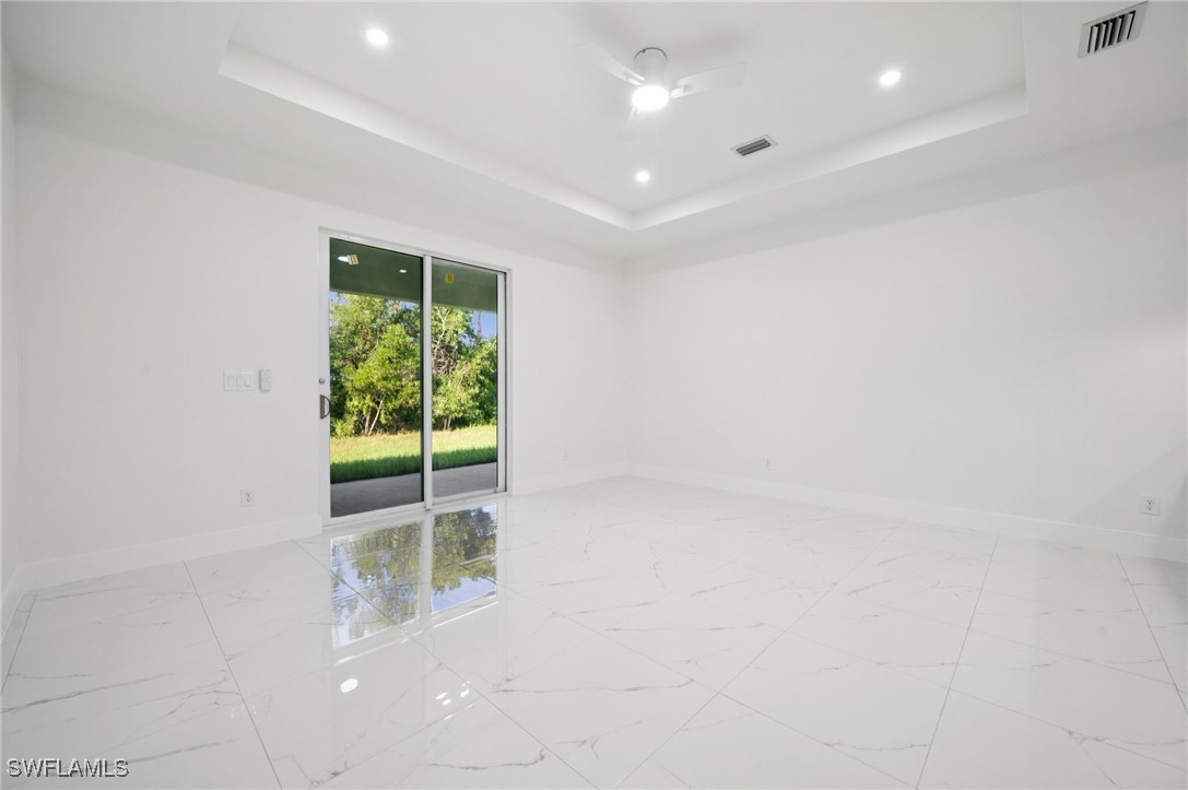 4701-4703 28th Street Southwest Lehigh Acres, FL 33973 - Photo 6 of 37 a view of an empty room with a window