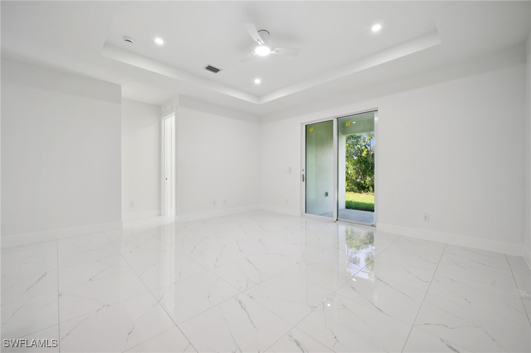 4701-4703 28th Street Southwest Lehigh Acres, FL 33973 - Photo 7 of 37 an empty room with an entryway and window