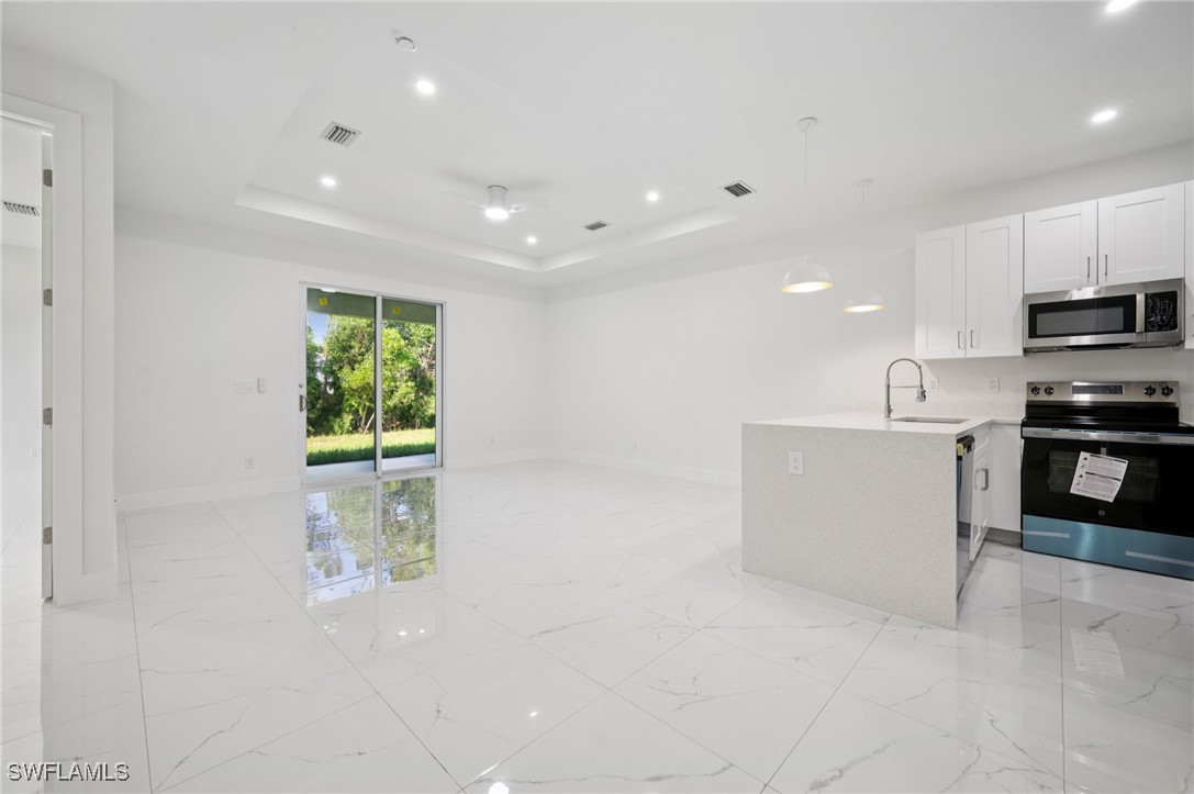 4701-4703 28th Street Southwest Lehigh Acres, FL 33973 - Photo 8 of 37 a view of kitchen with stainless steel appliances cabinets