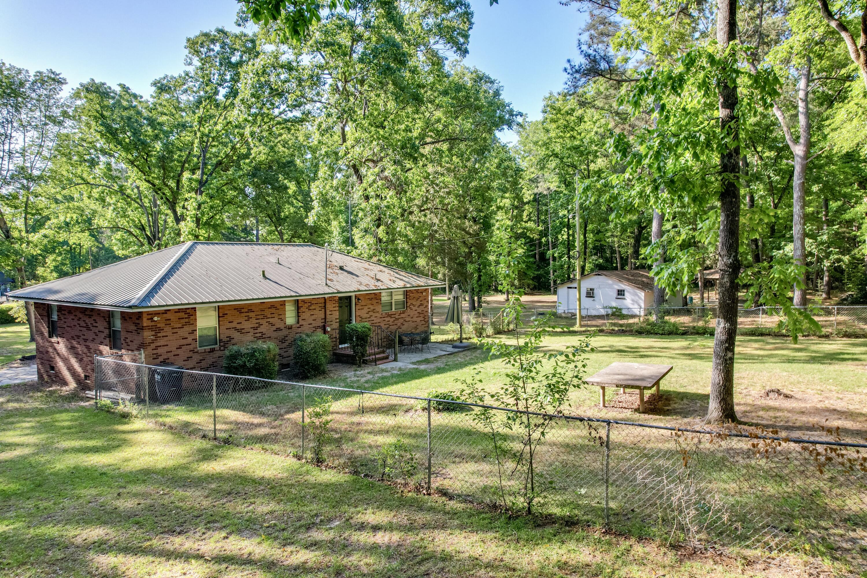 800 Old Whiskey Road South New Ellenton, SC 29809 - Photo 24 of 31 a view of a swimming pool with a garden