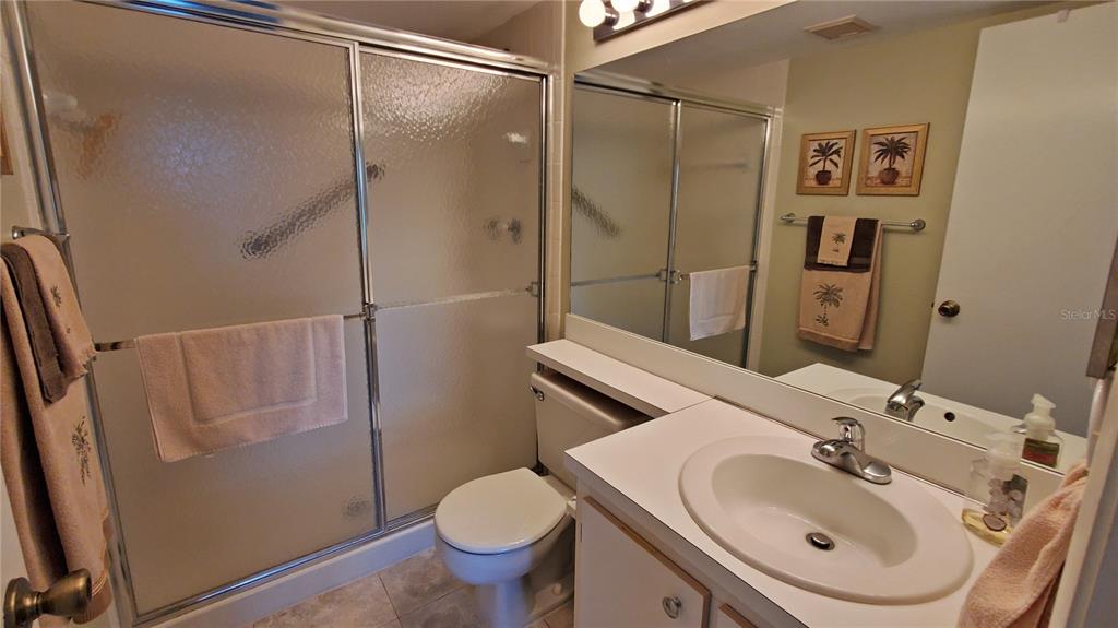 928 South Pine Ridge Circle Sanford, FL 32773 - Photo 17 of 22 a bathroom with a sink and mirror with toilet
