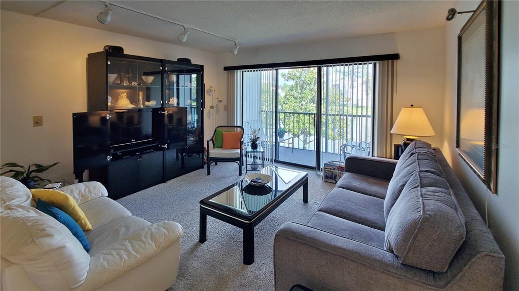 928 South Pine Ridge Circle Sanford, FL 32773 - Photo 4 of 22 a living room with furniture and a window
