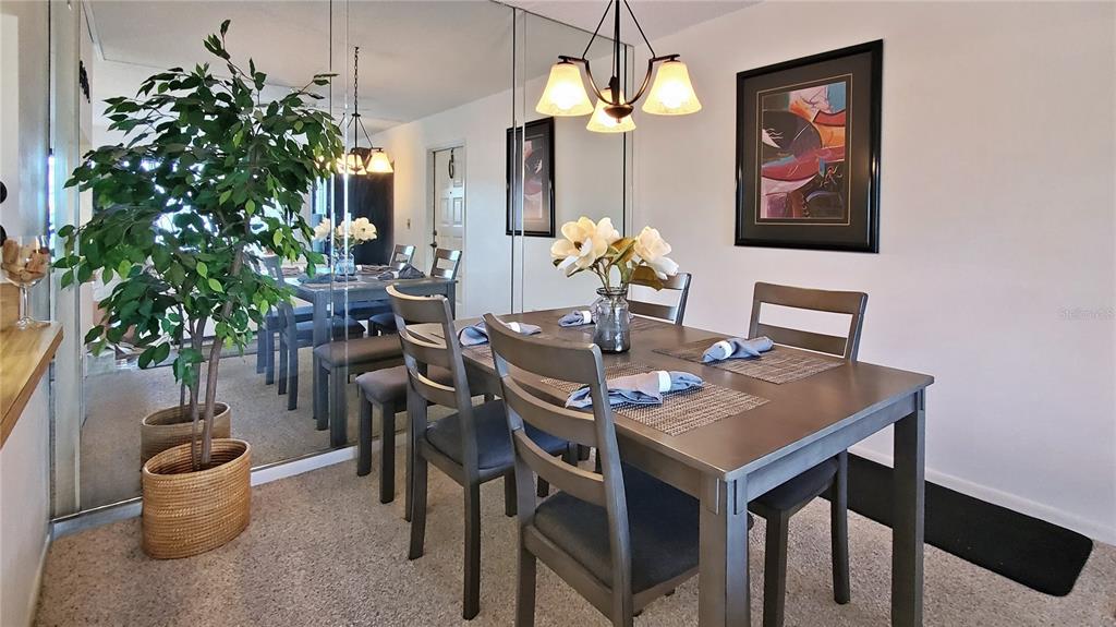 928 South Pine Ridge Circle Sanford, FL 32773 - Photo 7 of 22 a view of a dining room with furniture and chandelier