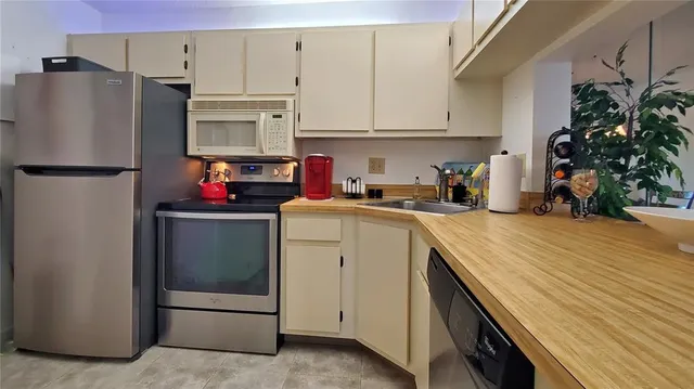 a wooden bench sitting in front of a building