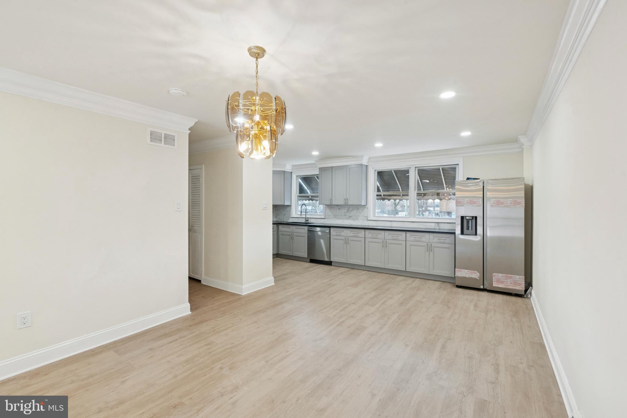 411 West Shunk Street Philadelphia, PA 19148 - Photo 11 of 25 a view of a kitchen with a sink stainless steel appliances and cabinets