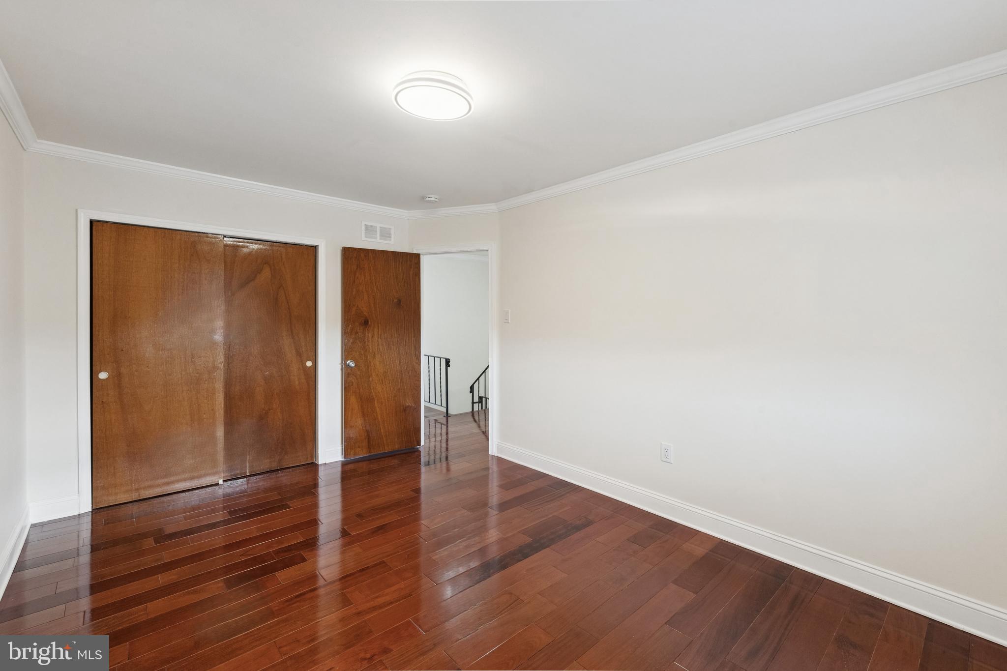 411 West Shunk Street Philadelphia, PA 19148 - Photo 16 of 25 a view of an empty room with wooden floor and closet