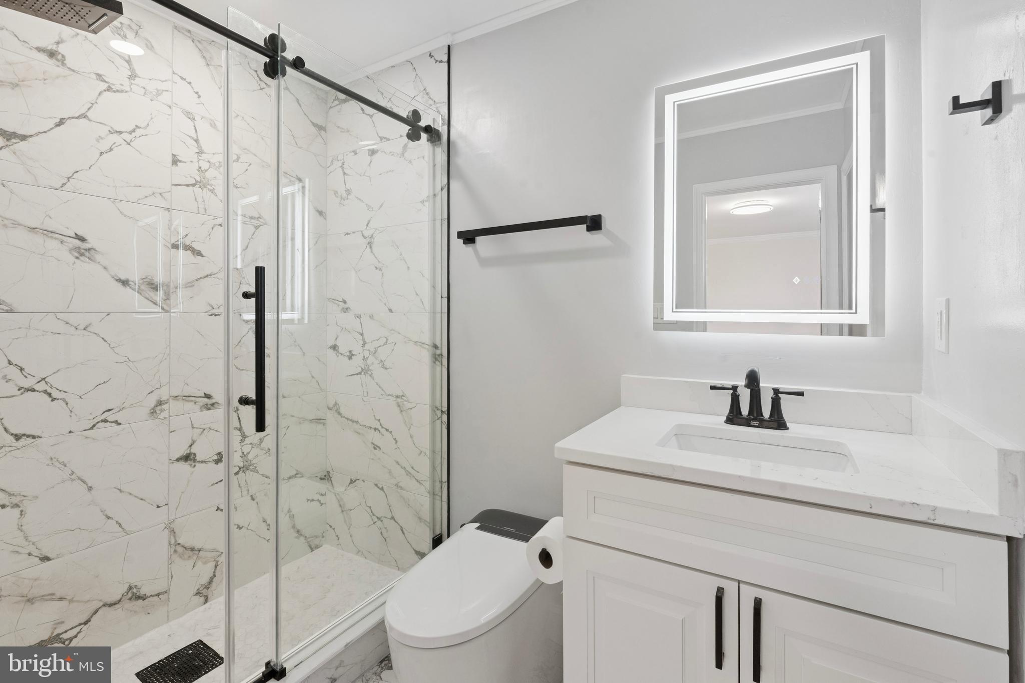 411 West Shunk Street Philadelphia, PA 19148 - Photo 21 of 25 a bathroom with a sink a toilet and shower