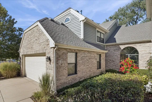 a view of front door with yellow lighting