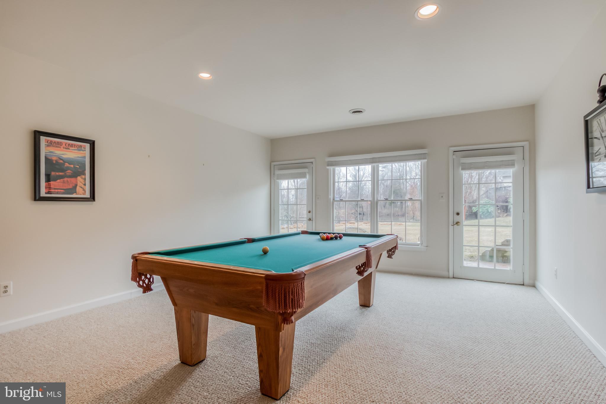 1910 Merrifields Drive Silver Spring, MD 20906 - Photo 31 of 47 Basement walks out to brick patio and pond
