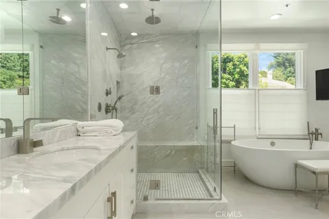 a bathroom with a bathtub and a sink