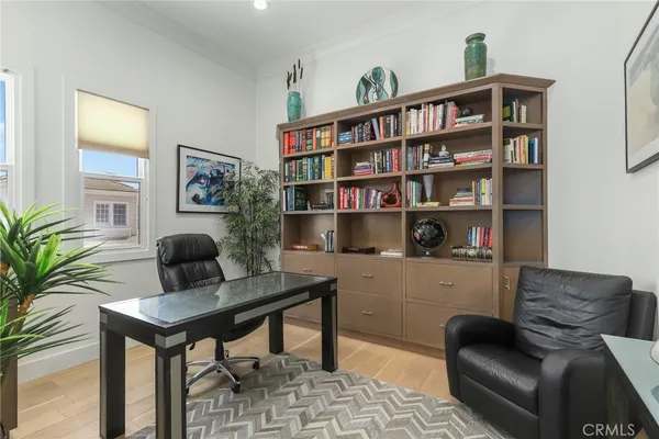 a workspace with furniture and a book shelf