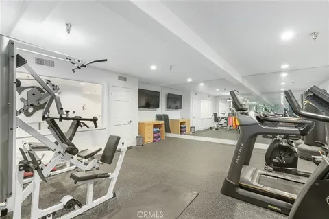 a view of a patio with couches chairs and a potted plant