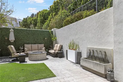 a view of an chairs and tables in the patio