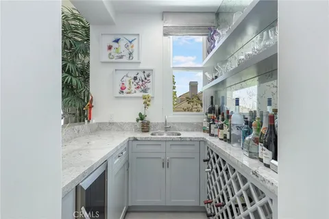 a view of a hallway with a white cabinets